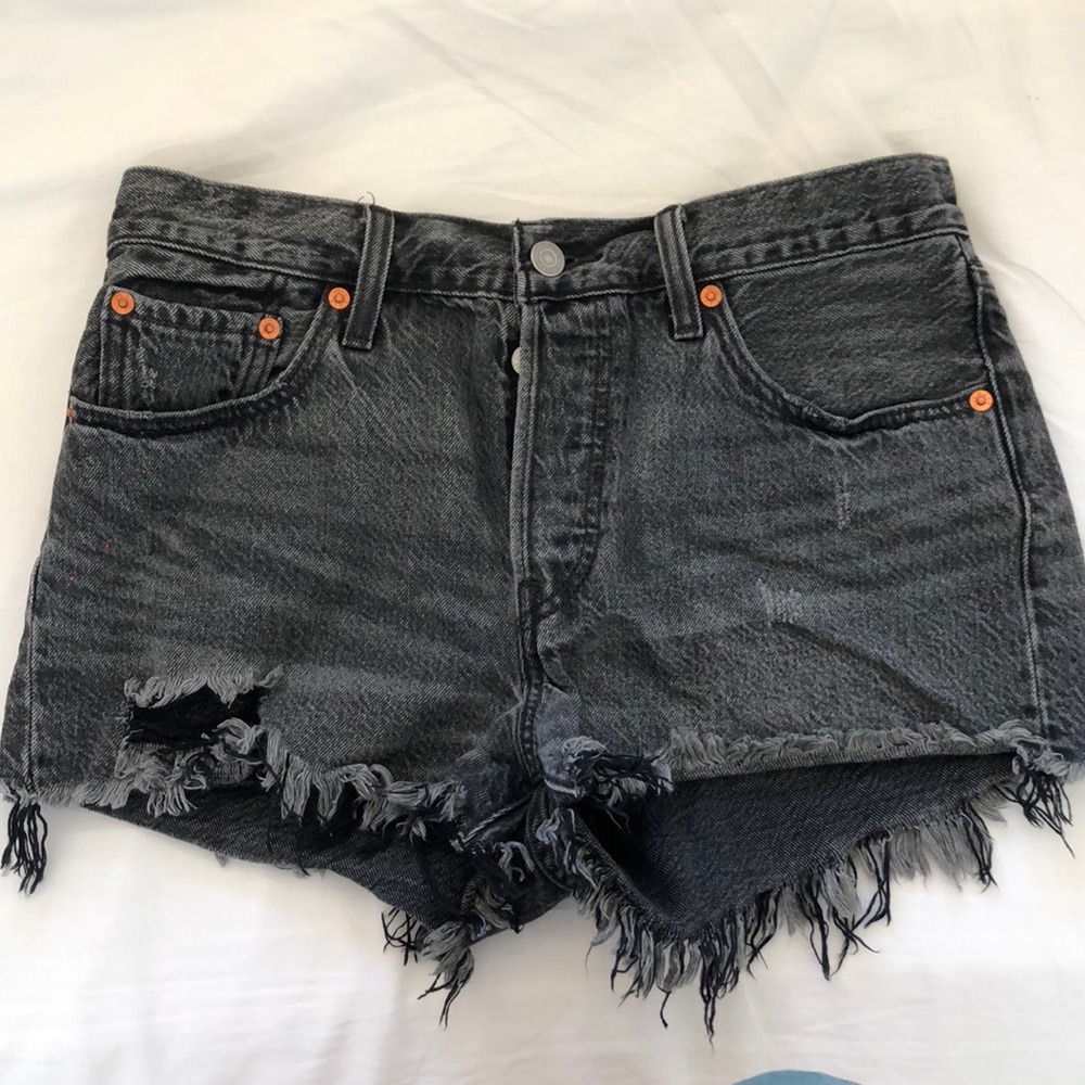 Faded black Levi cut offs